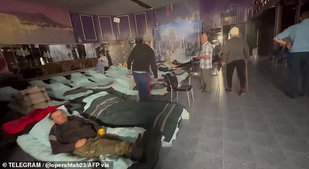 Evacuees rest at an emergency shelter after their evacuation from an area attacked by a Ukrainian drone on September 21.