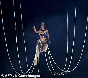 As she was lifted above the stage, Katy had a big smile on her face and raised her arms in the air