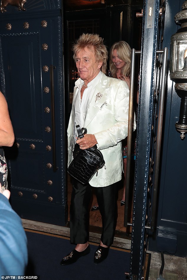 The singer appeared to be enjoying himself as he was spotted leaving The George Club in Mayfair, London