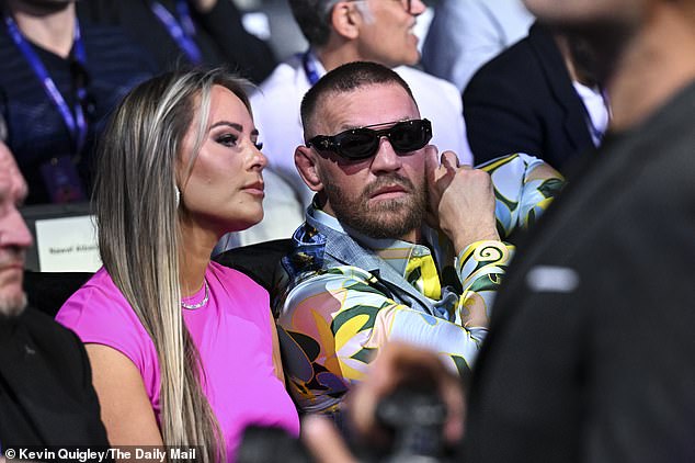 Irishman McGregor sat next to his wife Dee Devlin, in the middle of a crowd of 96,000 people at Wembley