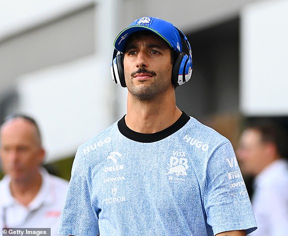 SINGAPORE, SINGAPORE - SEPTEMBER 22: Daniel Ricciardo of Australia and Visa Cash App RB walk through the paddock prior to the F1 Grand Prix of Singapore at Marina Bay Street Circuit on September 22, 2024 in Singapore, Singapore. (Photo by Clive Mason/Getty Images)