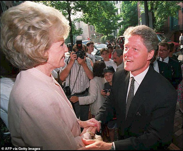 Democratic presidential candidate Bill Clinton greets Pamela Harriman on the steps of her Georgetown home in August 1992 after a fundraiser