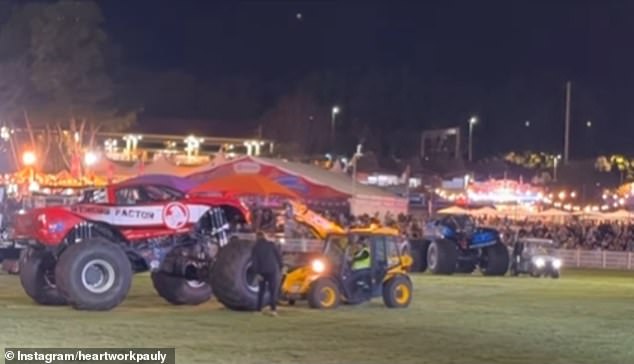 That same night, a red monster truck had completed a series of jumps, but broke down and had to be towed away (photo)