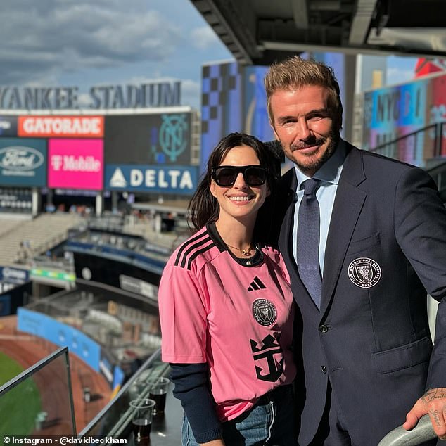 Beckham poses with actress Anne Hathaway at Yankee Stadium on Saturday afternoon