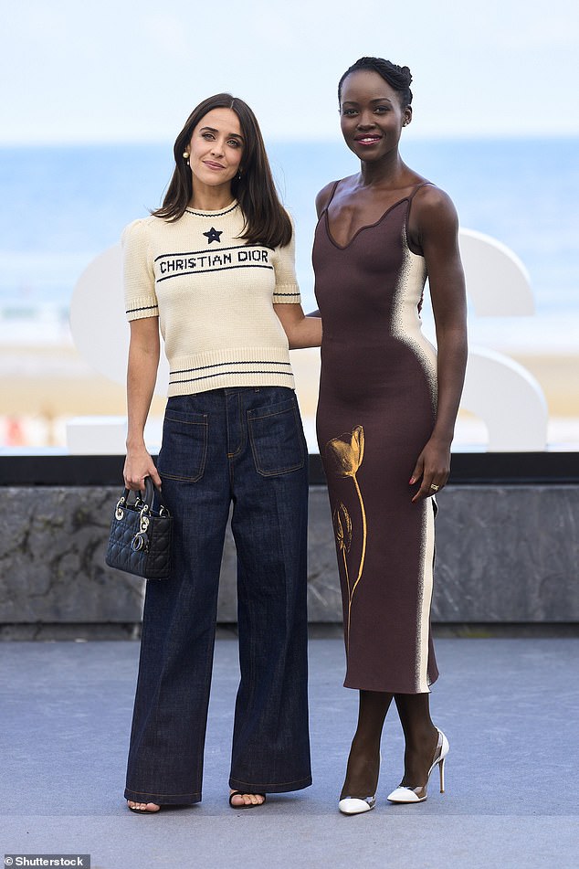 She posed next to Spanish actress Macarena Garcia, who made a fashion statement in a cream-colored short-sleeved knitted top by Dior and wide-leg jeans