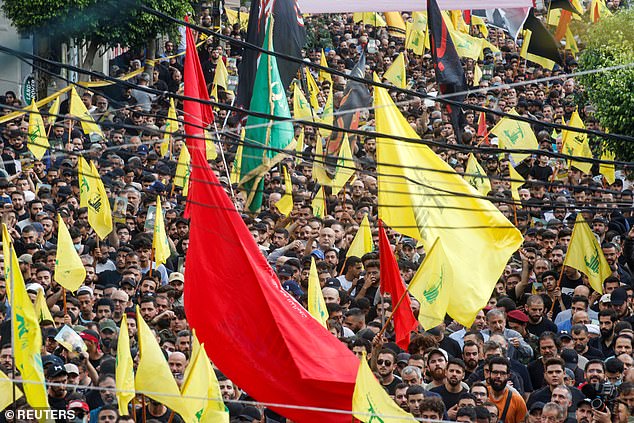 Relatives gather during the funeral of Hezbollah leader Ibrahim Aqil, who was killed in an Israeli raid on Beirut's southern suburbs on Friday.