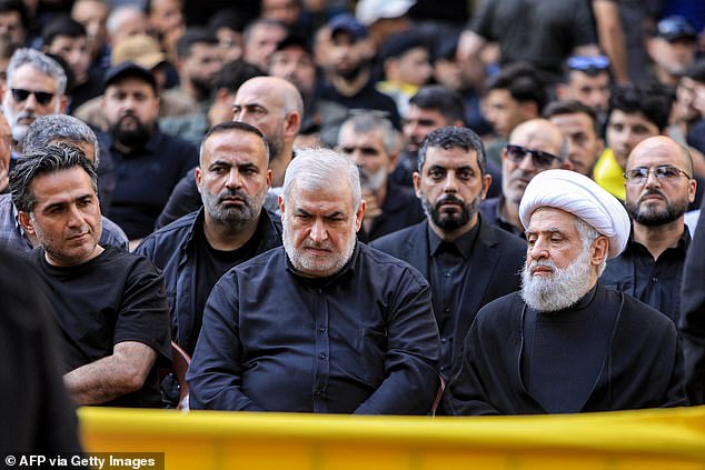 Naim Qassem (right), deputy secretary general of Hezbollah, and Mohammed Raad (center), head of the Hezbollah bloc in the Lebanese parliament, attend Aqil's funeral