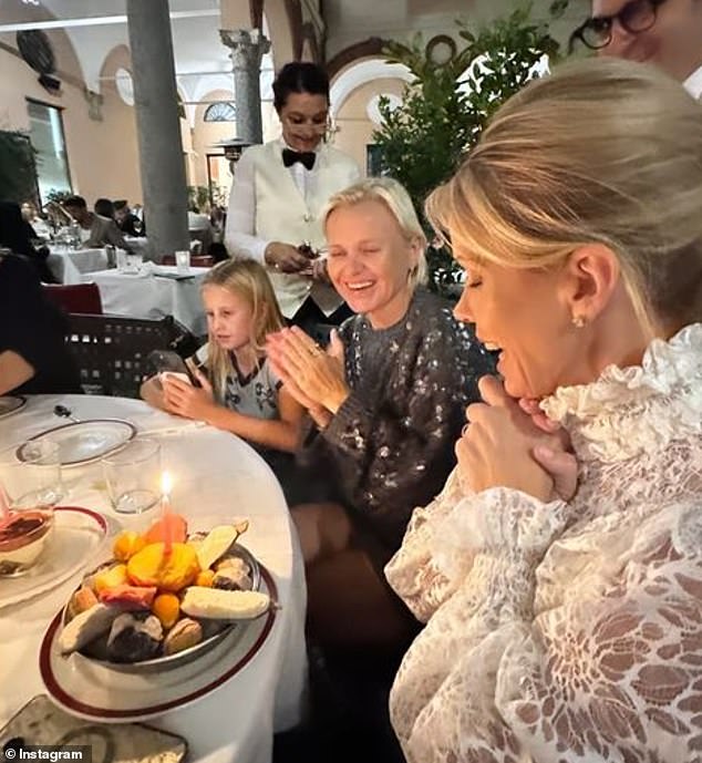 In another photo posted to Catherine's profile, Hines was seen grinning from ear to ear as she held her hands in front of her face while blowing out her birthday candles