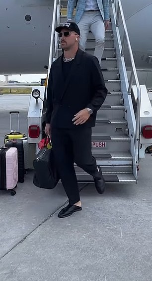 Travis Kelce stepped off the plane in Atlanta wearing an all-black ensemble