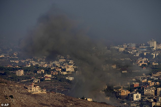 Smoke rises from an Israeli airstrike on the village of Kfar Rouman, seen from the town of Marjayoun, southern Lebanon