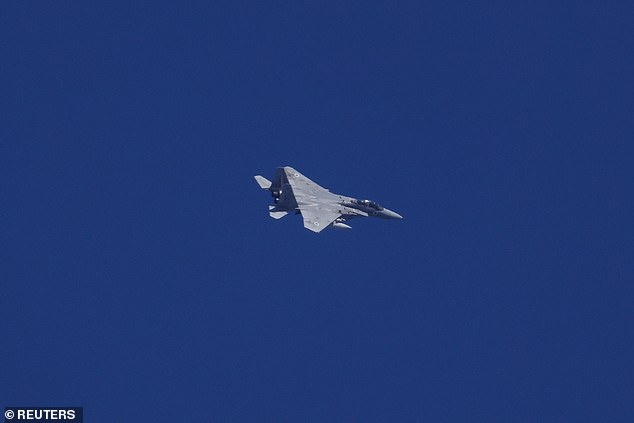 An Israeli fighter jet flies amid cross-border hostilities between Hezbollah and Israel, seen from northern Israel, September 23, 2024