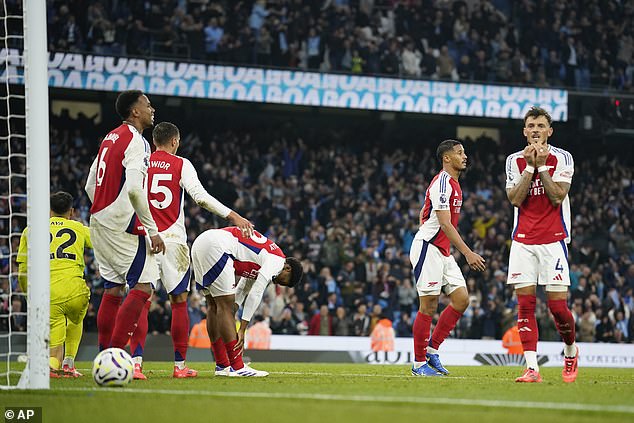 Arsenal's players looked distraught after conceding City's late equaliser, having worked tirelessly throughout the second half to frustrate the champions from inside their own penalty area