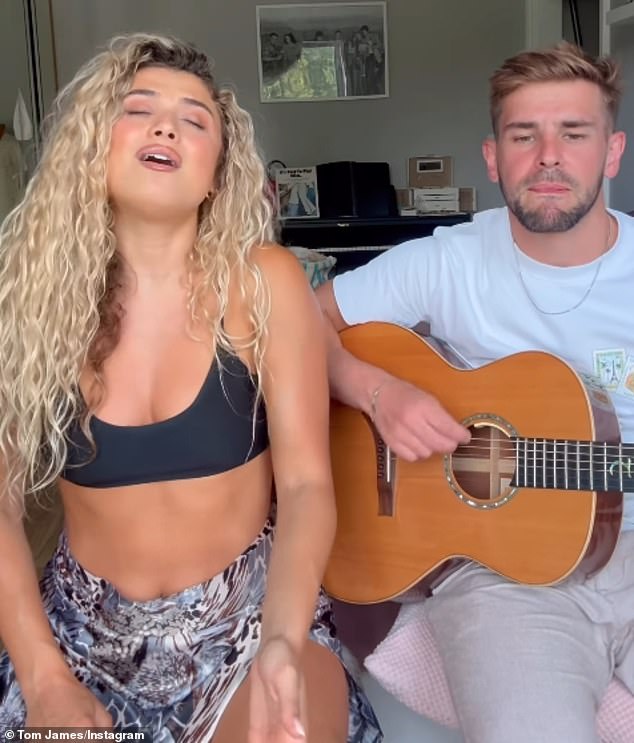 James is pictured singing a duet with Love Island star Antigoni Buxton