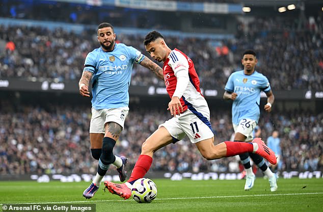 Walker (left) was caught out of position as he attempted to recover from an Arsenal free kick