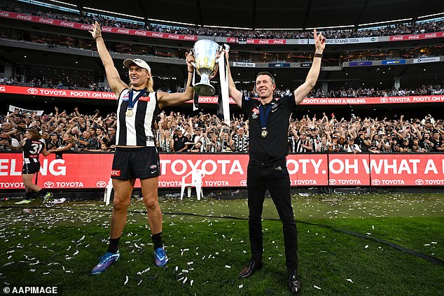 His dedication and hard work paid off when he was appointed Collingwood head coach in 2021. (Pictured with Darcy Moore when Collingwood won the 2023 AFL Grand Final)