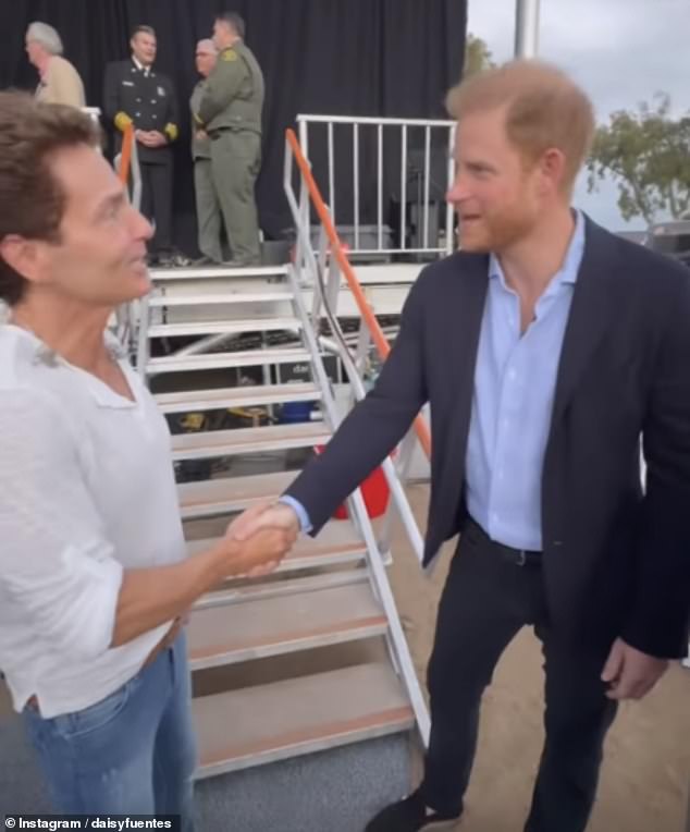 Pictured: Prince Harry shakes hands with Richard Marx, who performed at Kevin Costner's One805Live! concert yesterday