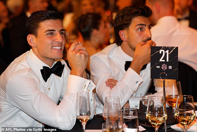 The Brownlow Medal ceremony began at 8pm on Monday night with AFL stars Nick Daicos (left), Marcus Bontempelli, Patrick Cripps and Lachie Neale - who competed for the prestigious award