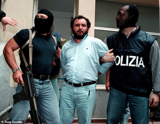 Brusca is escorted to prison by the anti-mafia police in Palermo. The fugitive mafia was sentenced to 30 years in prison, but was released five years early in 2021 for good behavior