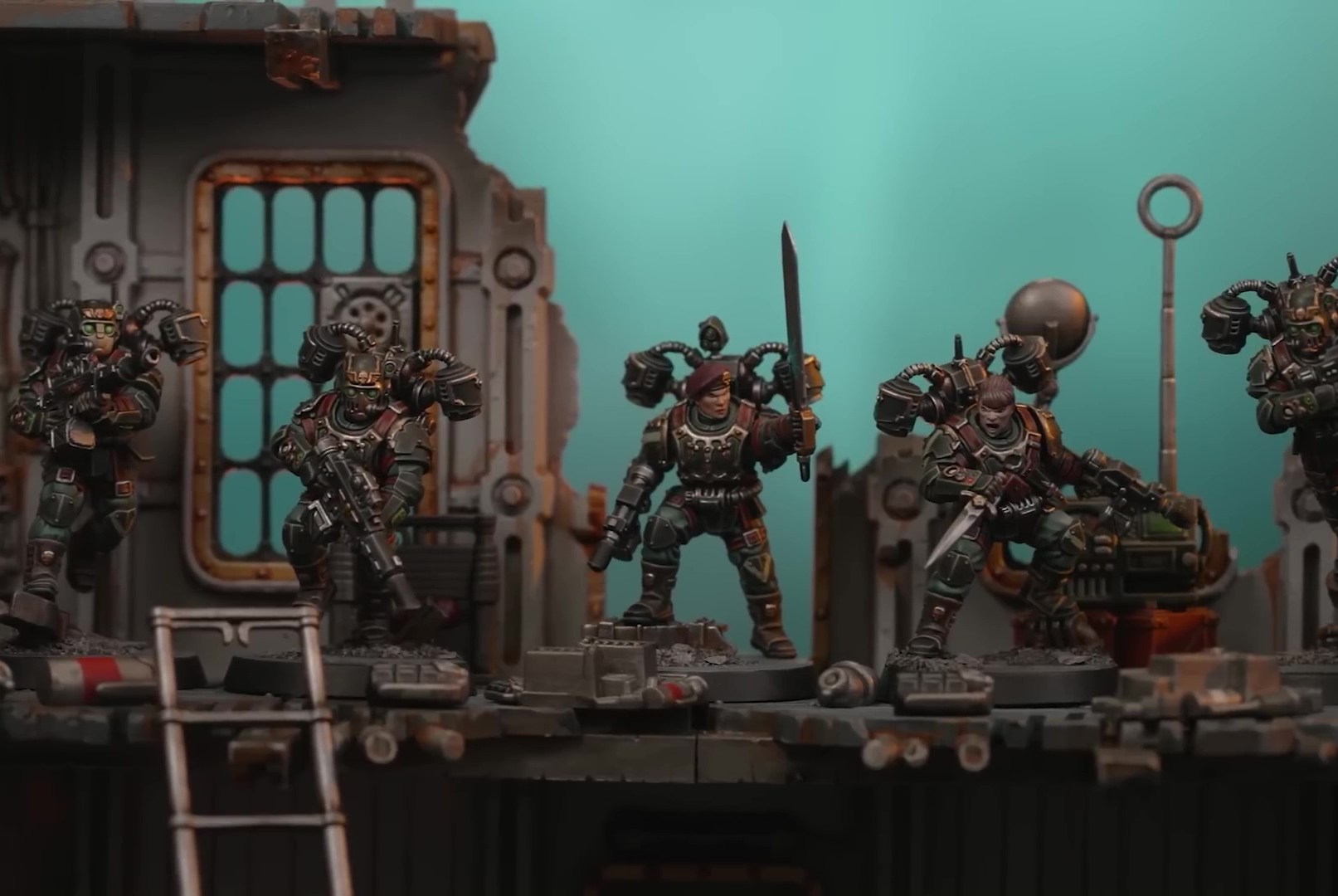 A group of miniatures of the Tempestus Aquilons of the Imperial Guard, displayed in front of a terrain for the board game Warhammer 40,000: Kill Team - Hivestorm