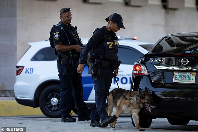 Law enforcement officers stand outside the Paul G Rogers Federal Building US Courthouse before the public for Ryan W. Routh