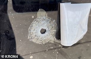 Bullet holes riddled storefronts on E 18th Street Sunday morning