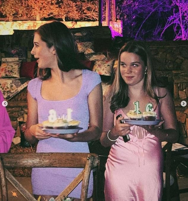 The girls wore pastel colors as they held their birthday cupcakes