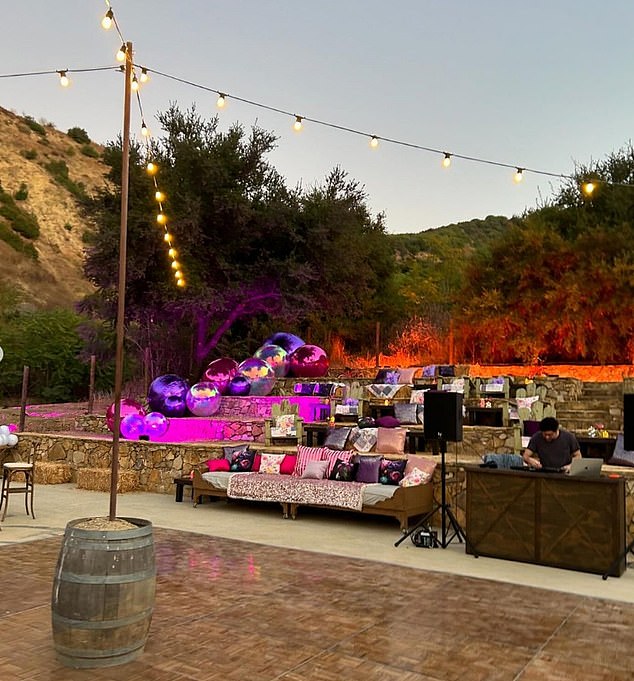 The party was held in a backyard in LA with several seating areas and a DJ on the right side