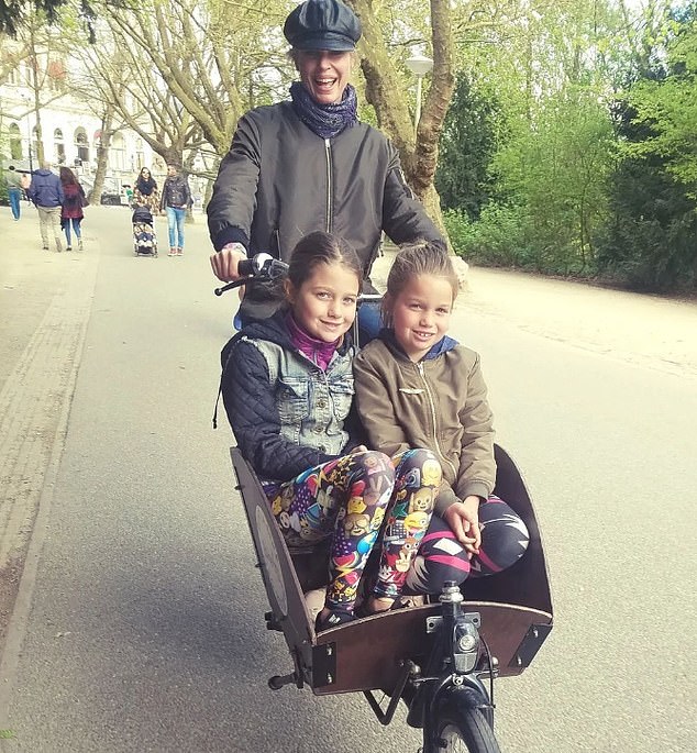 Here the girls are seen as small children in a pram