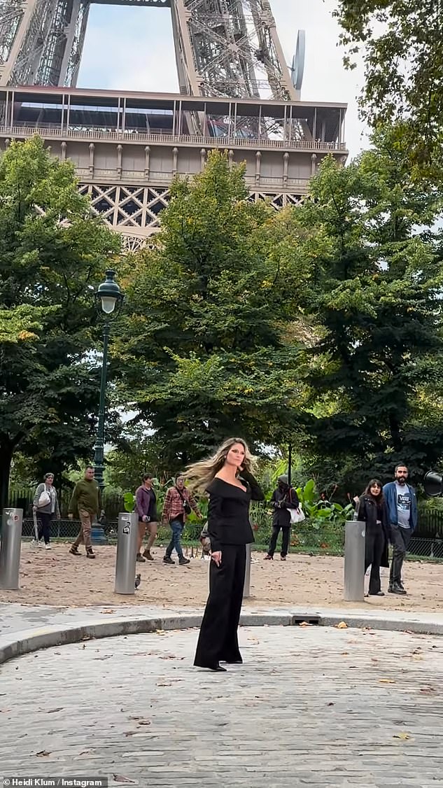 At one point, Heidi was seen from a distance posing in front of the Eiffel Tower