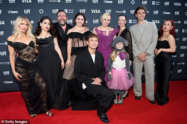 Wilson posed with some of the cast and crew at the film's red carpet premiere at the Toronto Film Festival on September 14