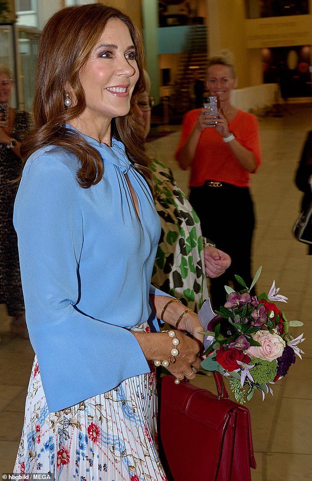 The 52-year-old royal was photographed looking radiant as she attended the event in Copenhagen today