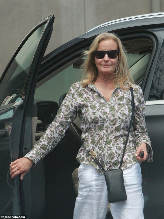 The petite blonde looked fit and fabulous as ever, dressed in a green floral blouse, white linen pants and canvas sneakers, and dark sunglasses