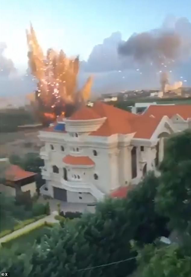 A huge explosion is seen near a residential building in southern Lebanon