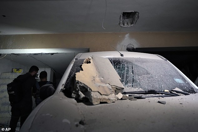 Damage to a house and a car after an Israeli airstrike near Beirut on Monday