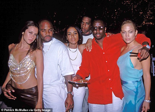 (L-R) Natane Adcock, Damon Dash, the late Aaliyah, Jay Z, Sean "Puff Papa" Combs and Jennifer Lopez at Puff Daddy's 4th of July party on July 2, 2000 in East Hampton, New York