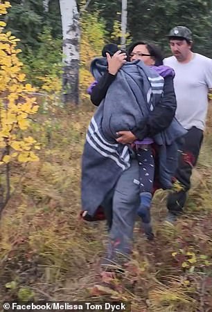 The girl's mother took her in her arms and carried her to safety