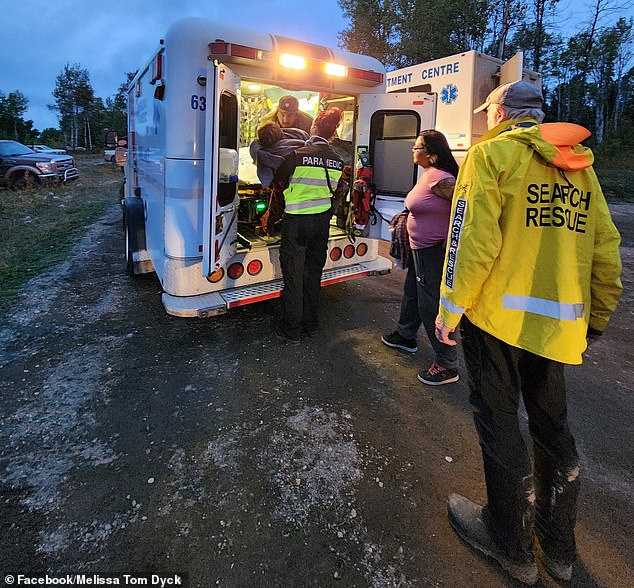 Volunteers cheered as the young girl was brought to safety Sunday evening