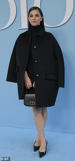 Meanwhile, Marisa Abela opted for an oversized black tent coat as she put on a lengthy show in the ensemble