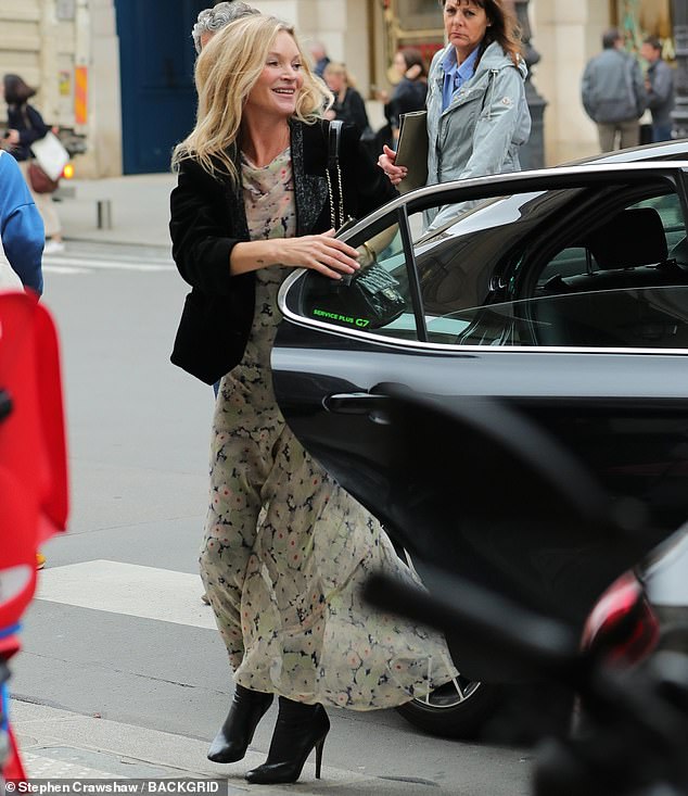 She beamed at her fans as she closed her car door herself, even though the car was being driven