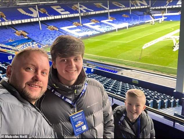 Chris Neill with his sons Reece, 17, and Archie, eight, on Everton's Goodison Park pitch