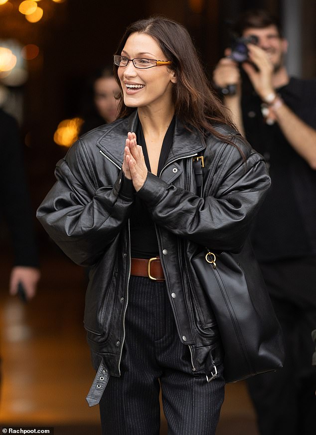 The Amazon showed off her gorgeous smile as she walked out of her hotel wearing a chic pair of reading glasses