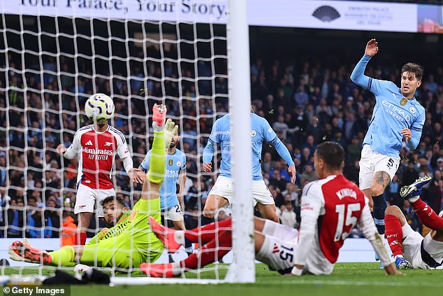 John Stones broke through Arsenal's determined defence with an equaliser in the 98th minute