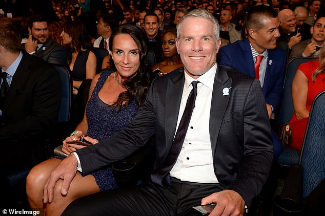 Favre sits next to his wife Deanna at the 2015 ESPY Awards in Los Angeles, California