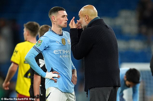 Foden pictured making direct eye contact with Guardiola during their post-match session