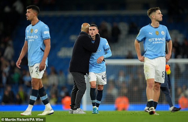 Manager Guardiola embraced the 24-year-old Foden before ending their public 'training session'