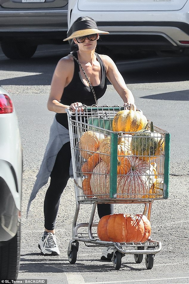 Garcia was photographed with a shopping cart full of pumpkins of all sizes as fall begins