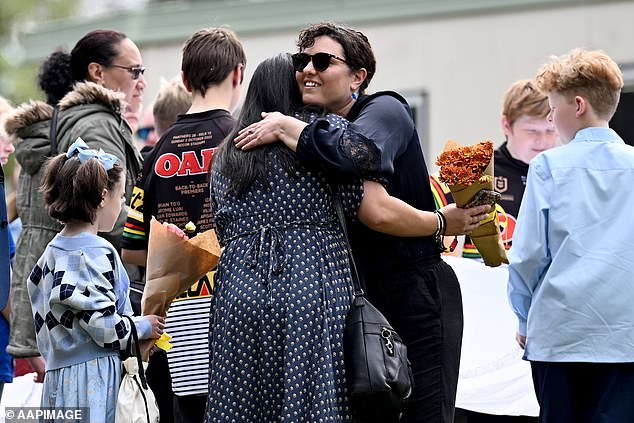 About 750 people turned out to wave goodbye to the two boys at the funeral in Springwood in the NSW Blue Mountains