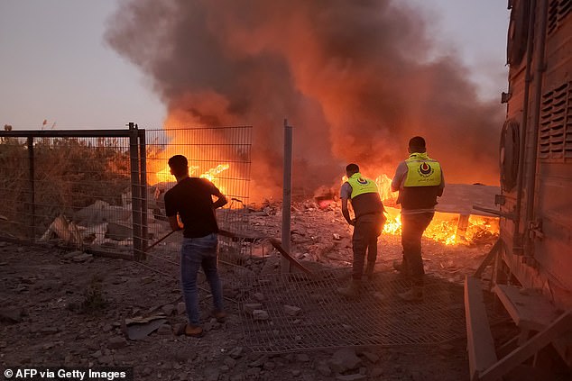 Fire rages at site of Israeli airstrike, death toll rises to 500