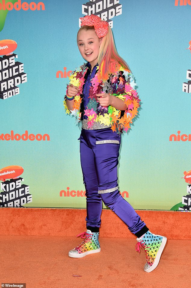 She's not afraid to push boundaries and stand out from her rainbow-colored child star hairdo (seen in 2019)