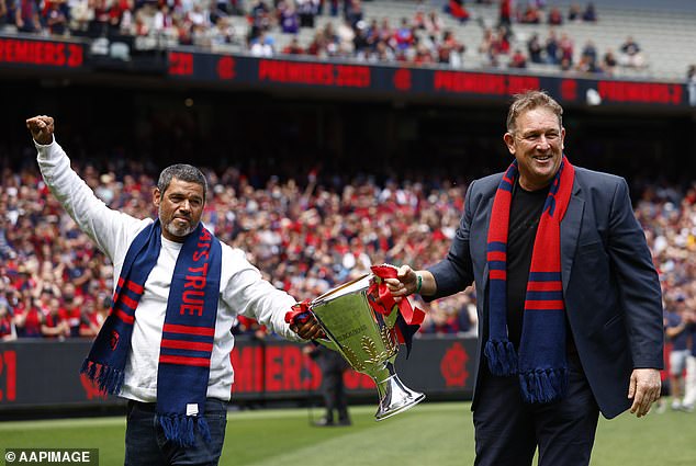 Schwarz (pictured right with former Demons teammate Jeff Farmer in 2021) described his mother as 